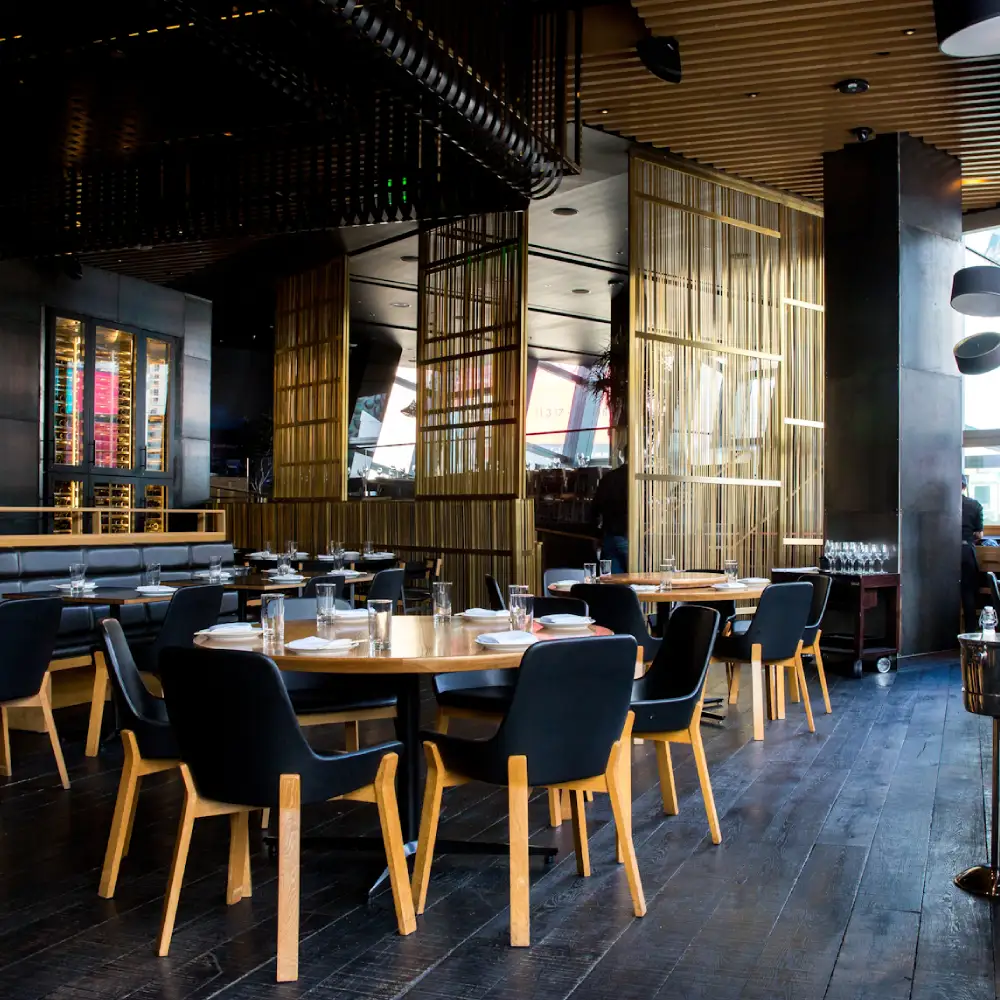 Creative restaurant interior design in Dubai with elegant seating and ambient lighting.