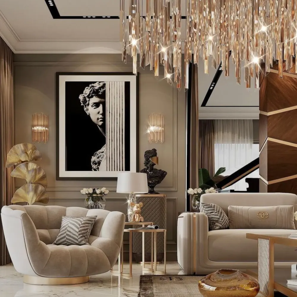 Luxury home interior design UAE featuring plush velvet seating, gold accents, and a grand crystal chandelier.